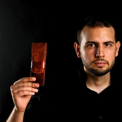 Man holding a brown full grain leather fountain pen case