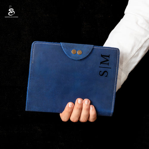 Person holding a blue A5 portfolio personalized with MS initials