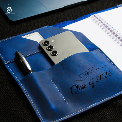 Close-up of blue A5 portfolio personalized for Class of 2026