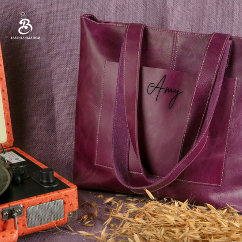 Purple leather tote bag personalized with an Amy script monogram