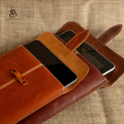 Open camel and brown iPad sleeves showing tablet fit