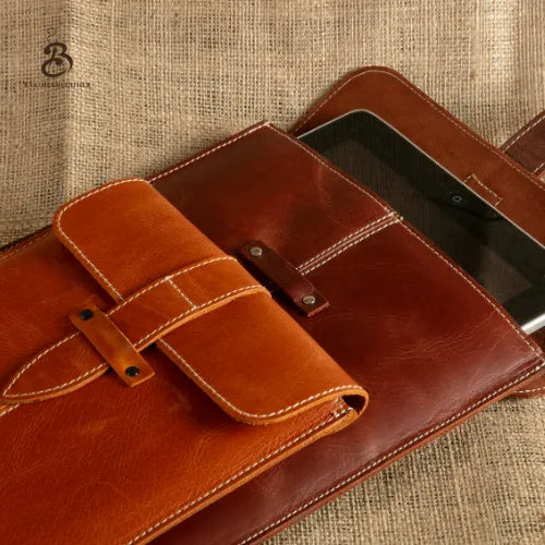 Open brown iPad sleeve with a matching leather accessory case