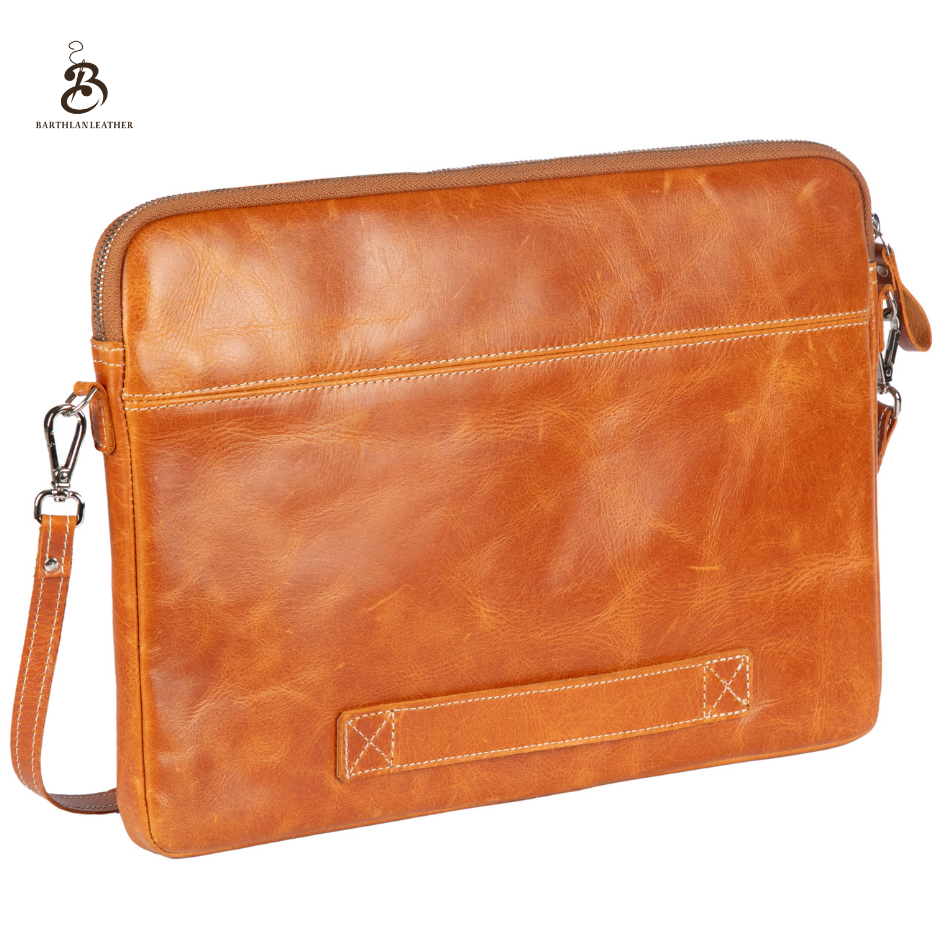 Back view of a camel leather laptop bag with carry handle