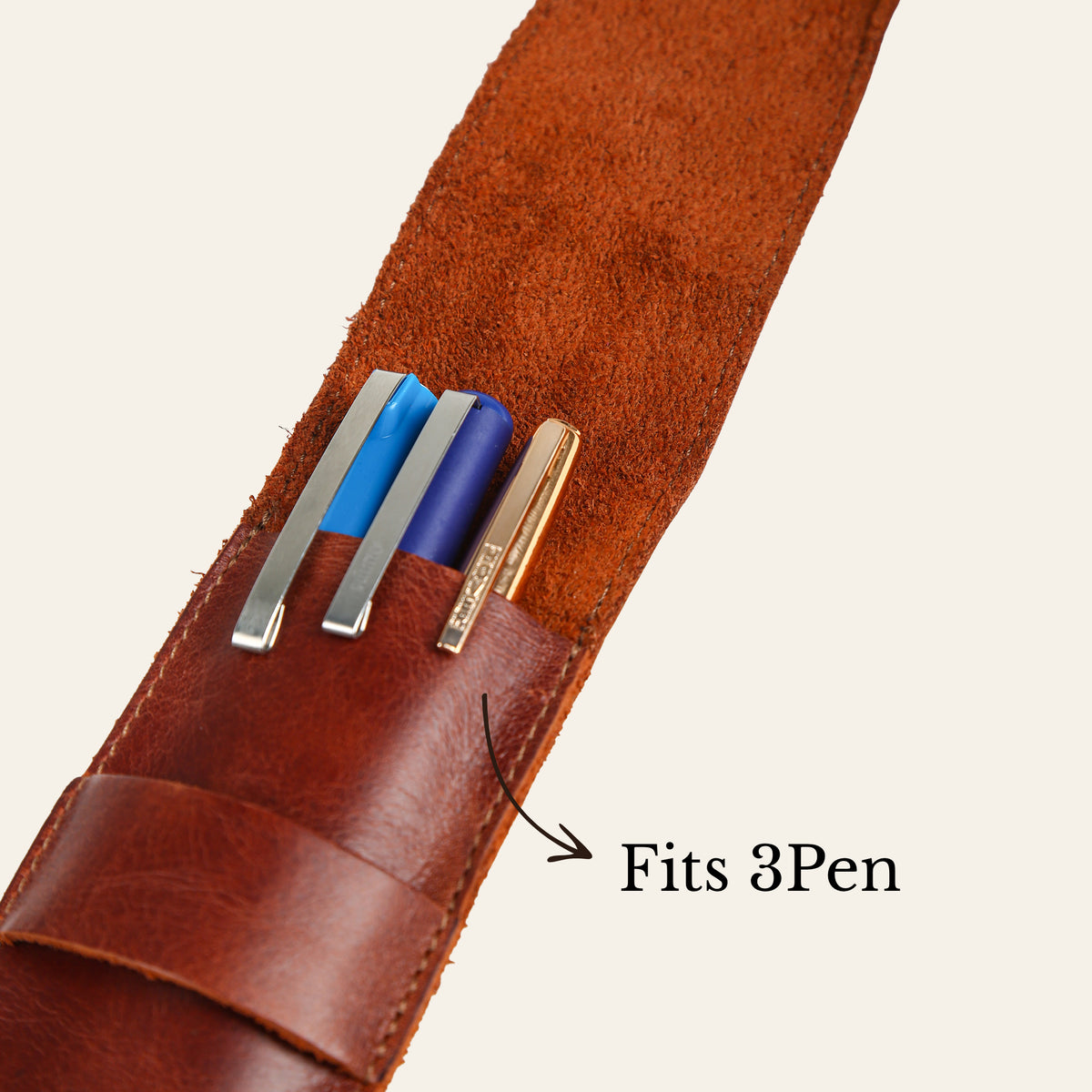 Open leather fountain pen case holding three pens